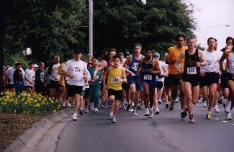 Photo taken in 1999 of large group of men and women of all ages running in a 5k