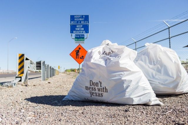 Don't mess with Texas trash bags on road 