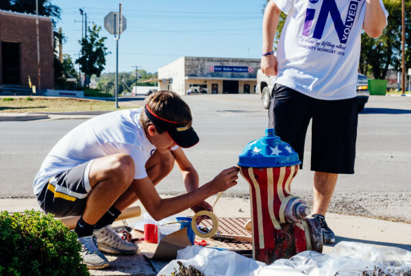 kids decorate fire hydrant red white + blue