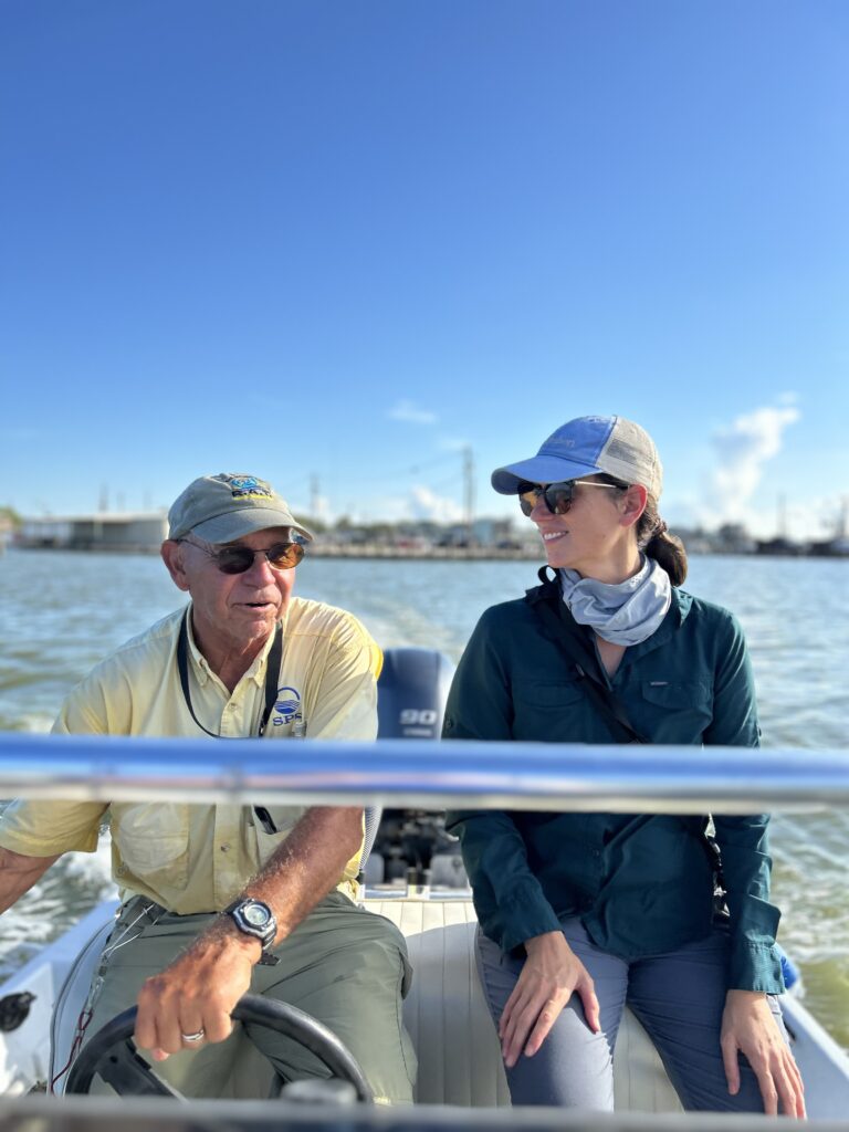 SABP Cleanup 2024 Two attendees in boat with marina in the background