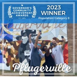 Pflugerville:, people posing for selfies by a mural